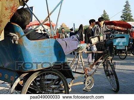 China, Beijing, person sitting in rickshaw, side view View Large Photo Image Stock Image - China, Beijing, person sitting in rickshaw, side view. Fotosearch