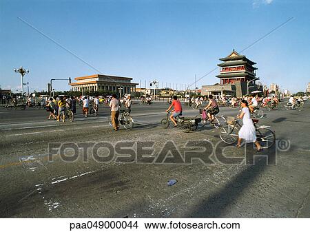 China, Beijing, Tiananmen Square, people walking with and riding bikes in street View Large Photo Image Picture - China, Beijing, Tiananmen Square, people walking with and riding bikes in street. Fotosearch
