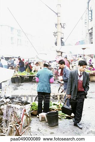 Stock Photo - China, Guangxin Autonomous Region, Laibin, open-air market. Fotosearch