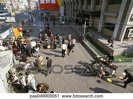 China, Xinjiang, Urumqi, people in street, high angle view View Large Photo Image Stock Image - China, Xinjiang, Urumqi, people in street, high angle view. Fotosearch