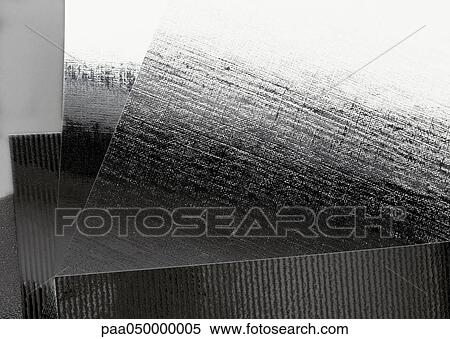 Stock Photography - Silvery sheets of paper, extreme close-up. Fotosearch