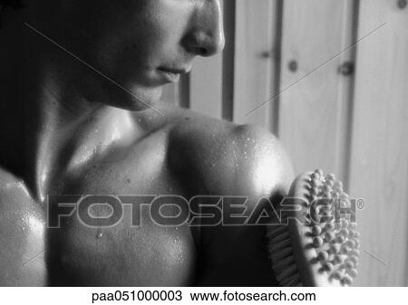 Bare-chested man, brush on arm, close-up, b&w View Large Photo Image Stock Image - Bare-chested man, brush on arm, close-up, b&w. Fotosearch