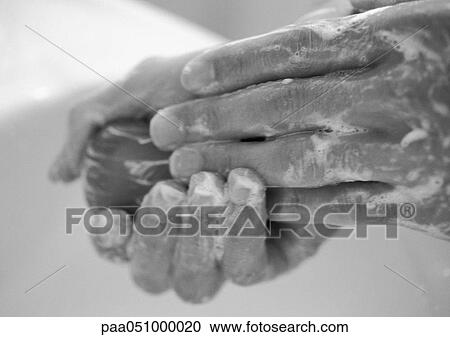 Hands covered with soap lather, holding bar of soap, close-up, b&w View Large Photo Image Stock Image - Hands covered with soap lather, holding bar of soap, close-up, b&w. Fotosearch