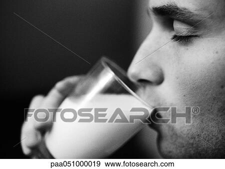 Man drinking from glass, side view, close-up, b&w View Large Photo Image Stock Photo - Man drinking from glass, side view, close-up, b&w. Fotosearch
