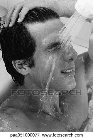 Man in bathtub, rinsing face, b&w View Large Photo Image Stock Photo - Man in bathtub, rinsing face, b&w. Fotosearch