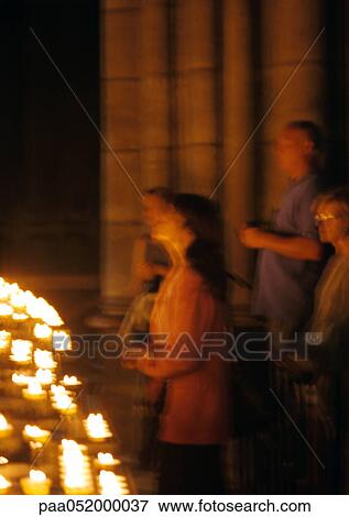 France, Paris, Notre Dame Cathedral, people standing by candles, blurred View Large Photo Image Stock Photo - France, Paris, Notre Dame Cathedral, people standing by candles, blurred. Fotosearch