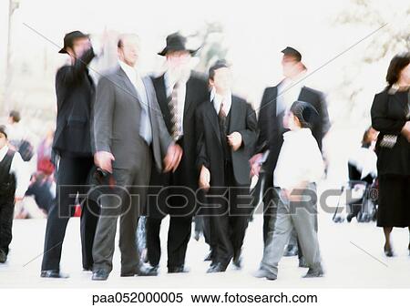 Stock Photography - Israel, Jerusalem, group of Orthodox Jews, outside, blurred. Fotosearch