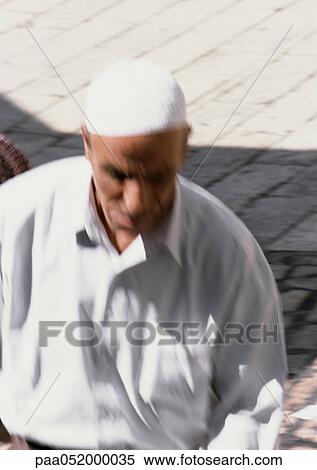 Stock Photography - Israel, Jerusalem, man walking in street. Fotosearch