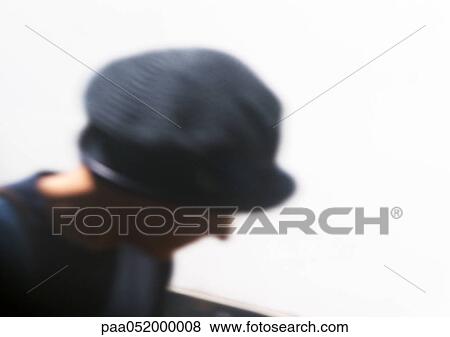 Stock Photo - Israel, Jerusalem, Mea Shearim (Orthodox Jewish Fundamentalist quarter), woman wearing hat, blurred. Fotosearch