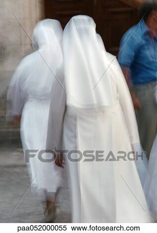 Stock Photography - Israel, Jerusalem, nuns, rear view, blurred. Fotosearch