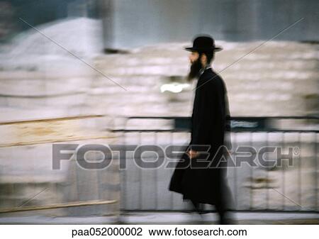Israel, Jerusalem, Orthodox Jew walking by barrier, side view, blurred View Large Photo Image Stock Image - Israel, Jerusalem, Orthodox Jew walking by barrier, side view, blurred. Fotosearch