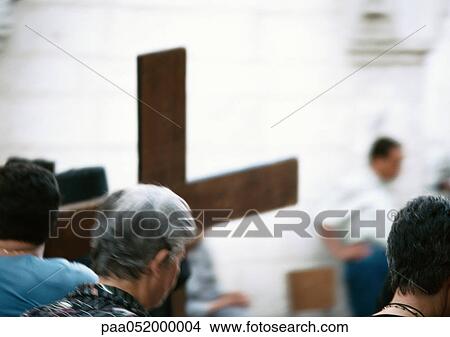 Israel, Jerusalem, people in Christian church, cross in background, blurred View Large Photo Image Picture - Israel, Jerusalem, people in Christian church, cross in background, blurred. Fotosearch