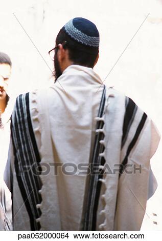 Picture - Man wearing kippa and talith, rear view. Fotosearch
