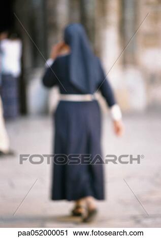 Nun, rear view, blurred View Large Photo Image Stock Image - Nun, rear view, blurred. Fotosearch