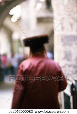 Stock Image - Orthodox Jew, rear view, blurred. Fotosearch