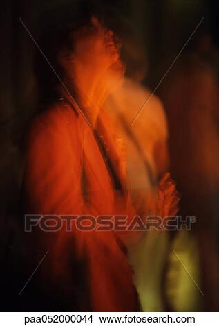 Picture - Silhouette of person in dark, blurred. Fotosearch