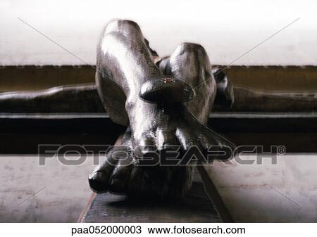Stock Image - Statue of crucifixion, low angle view. Fotosearch
