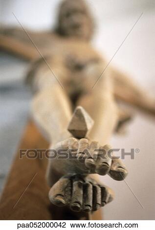 Statue of the Crucifixion, focus on feet, low angle view View Large Photo Image Stock Image - Statue of the Crucifixion, focus on feet, low angle view. Fotosearch