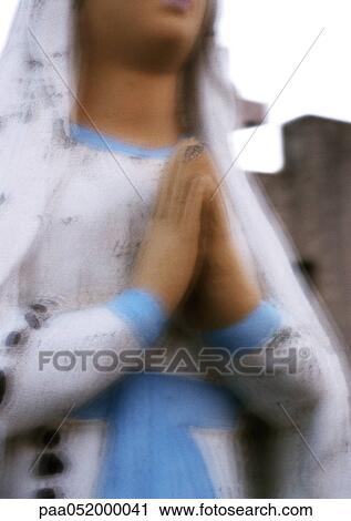 Statue of Virgin Mary with hands praying, partial view, blurred View Large Photo Image Stock Image - Statue of Virgin Mary with hands praying, partial view, blurred. Fotosearch