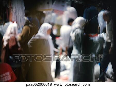 Women wearing headscarves in street, blurred View Large Photo Image Stock Photo - Women wearing headscarves in street, blurred. Fotosearch