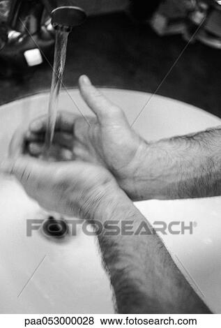 Man's hands under tap, blurred, b&w View Large Photo Image Stock Photo - Man's hands under tap, blurred, b&w. Fotosearch