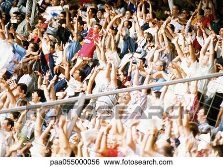 Crowd in stadium with arms in air View Large Photo Image Stock Photograph - Crowd in stadium with arms in air. Fotosearch