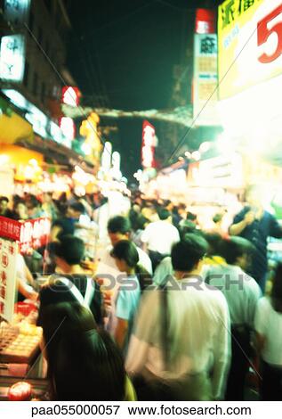 Crowded street at night, blurred View Large Photo Image Stock Photo - Crowded street at night, blurred. Fotosearch