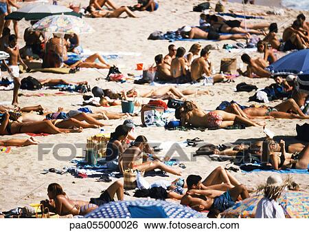 Stock Photograph - People on crowded beach, high angle view. Fotosearch