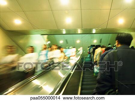 People on escalators, blurred View Large Photo Image Picture - People on escalators, blurred. Fotosearch