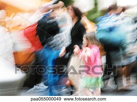 Stock Photo - People walking, blurred. Fotosearch