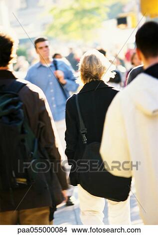 People walking, outside, blurred View Large Photo Image Picture - People walking, outside, blurred. Fotosearch