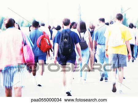 People walking, rear view, blurred View Large Photo Image Picture - People walking, rear view, blurred. Fotosearch
