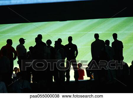 Silhouettes of people in stadium, rear view View Large Photo Image Stock Photo - Silhouettes of people in stadium, rear view. Fotosearch