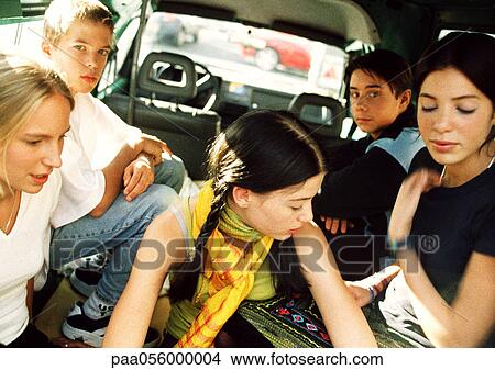 Five teenagers sitting in back of car View Large Photo Image Picture - Five teenagers sitting in back of car. Fotosearch