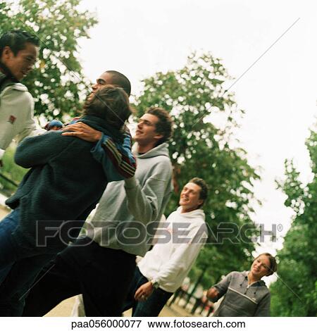 Stock Photo - Group of young people in park. Fotosearch