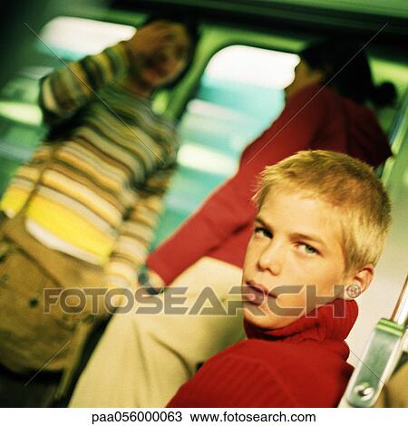 Teenagers in train, blurred backbround View Large Photo Image Stock Image - Teenagers in train, blurred backbround. Fotosearch