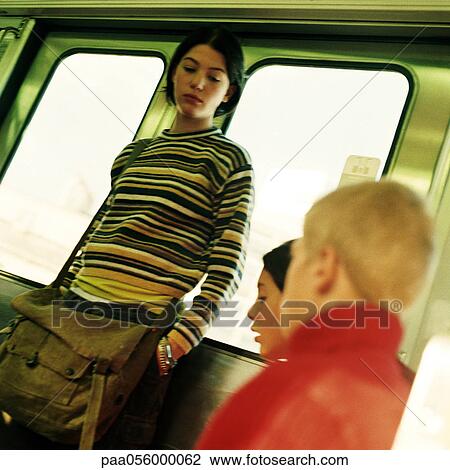 Three teenagers in subway train View Large Photo Image Stock Image - Three teenagers in subway train. Fotosearch