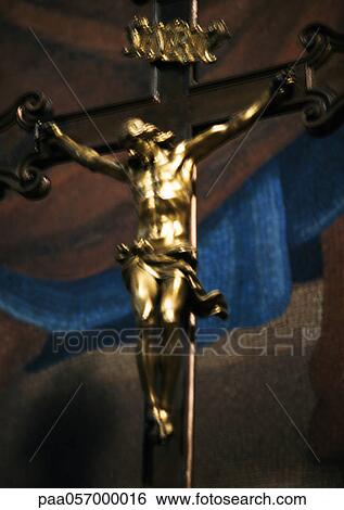 Stock Photograph - Gilded crucifixion statue. Fotosearch
