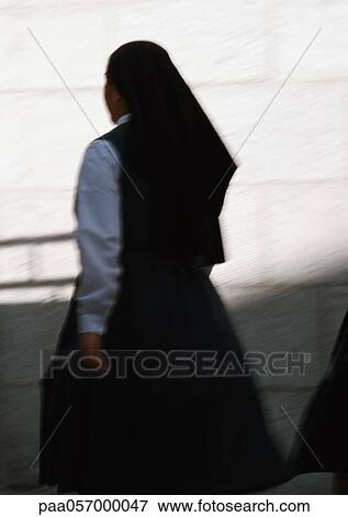 Nun, rear view, blurred motion View Large Photo Image Stock Photo - Nun, rear view, blurred motion. Fotosearch
