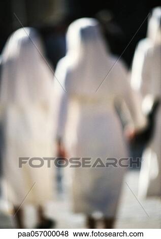 Nuns walking, rear view, blurred View Large Photo Image Stock Photo - Nuns walking, rear view, blurred. Fotosearch