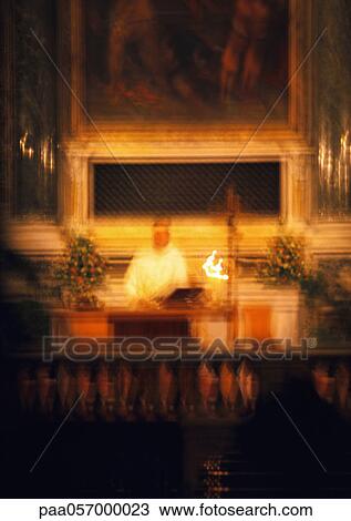 Priest behind altar, blurred View Large Photo Image Stock Image - Priest behind altar, blurred. Fotosearch