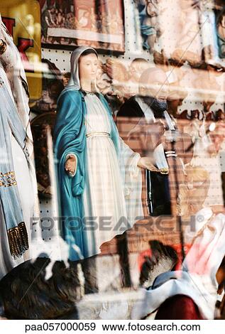 Statue of Virgin Mary behind glass with reflection View Large Photo Image Stock Photo - Statue of Virgin Mary behind glass with reflection. Fotosearch