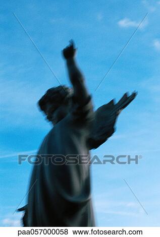 Statue, sky in background, blurred View Large Photo Image Stock Photo - Statue, sky in background, blurred. Fotosearch