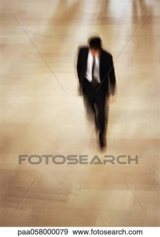 Businessman, high angle view, blurred View Large Photo Image Stock Photo - Businessman, high angle view, blurred. Fotosearch