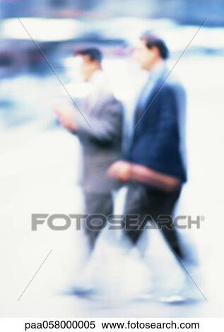 Businessmen walking, blurred View Large Photo Image Stock Photography - Businessmen walking, blurred. Fotosearch