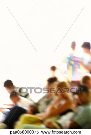 Stock Photography - Group of people sitting, blurred. Fotosearch