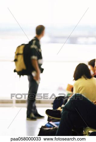 man carrying backpack