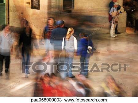 Stock Image - People in street, blurred. Fotosearch