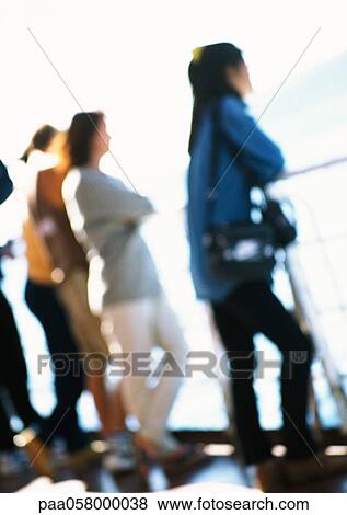 People leaning against railing, blurred View Large Photo Image Stock Photo - People leaning against railing, blurred. Fotosearch