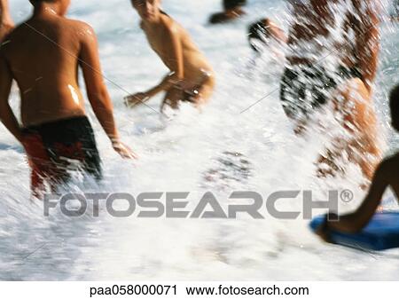 People splashing in sea, blurred View Large Photo Image Stock Image - People splashing in sea, blurred. Fotosearch